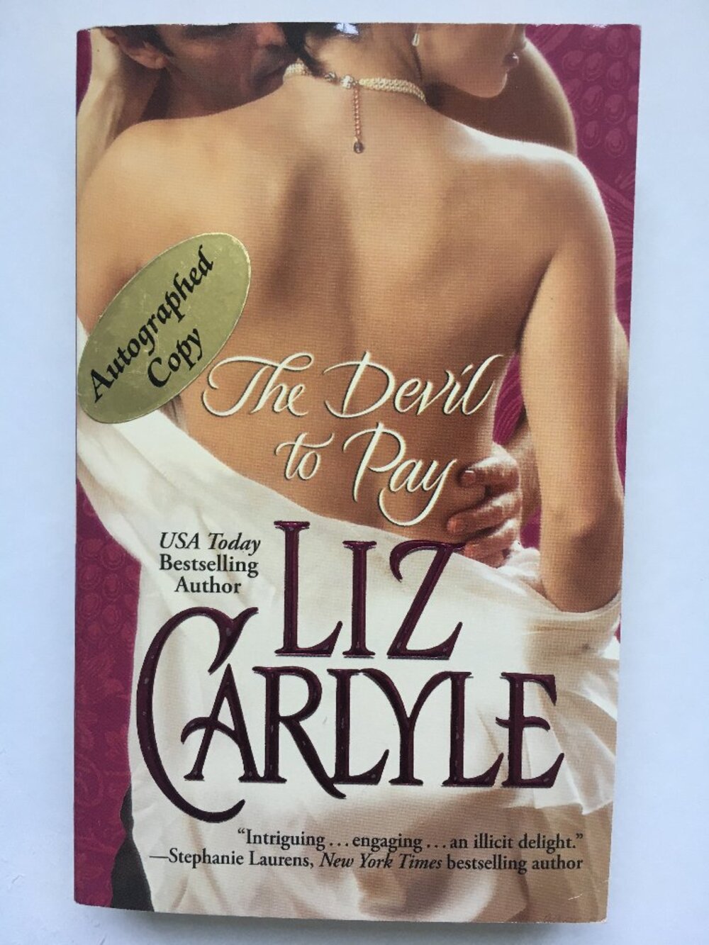 Autographed Liz Carlyle historical romance paperback, The Devil to Pay
